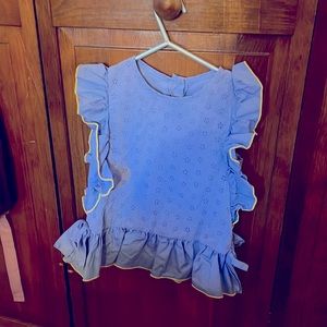 Blue size 5 sleeveless top with ruffles down the sides and bottom